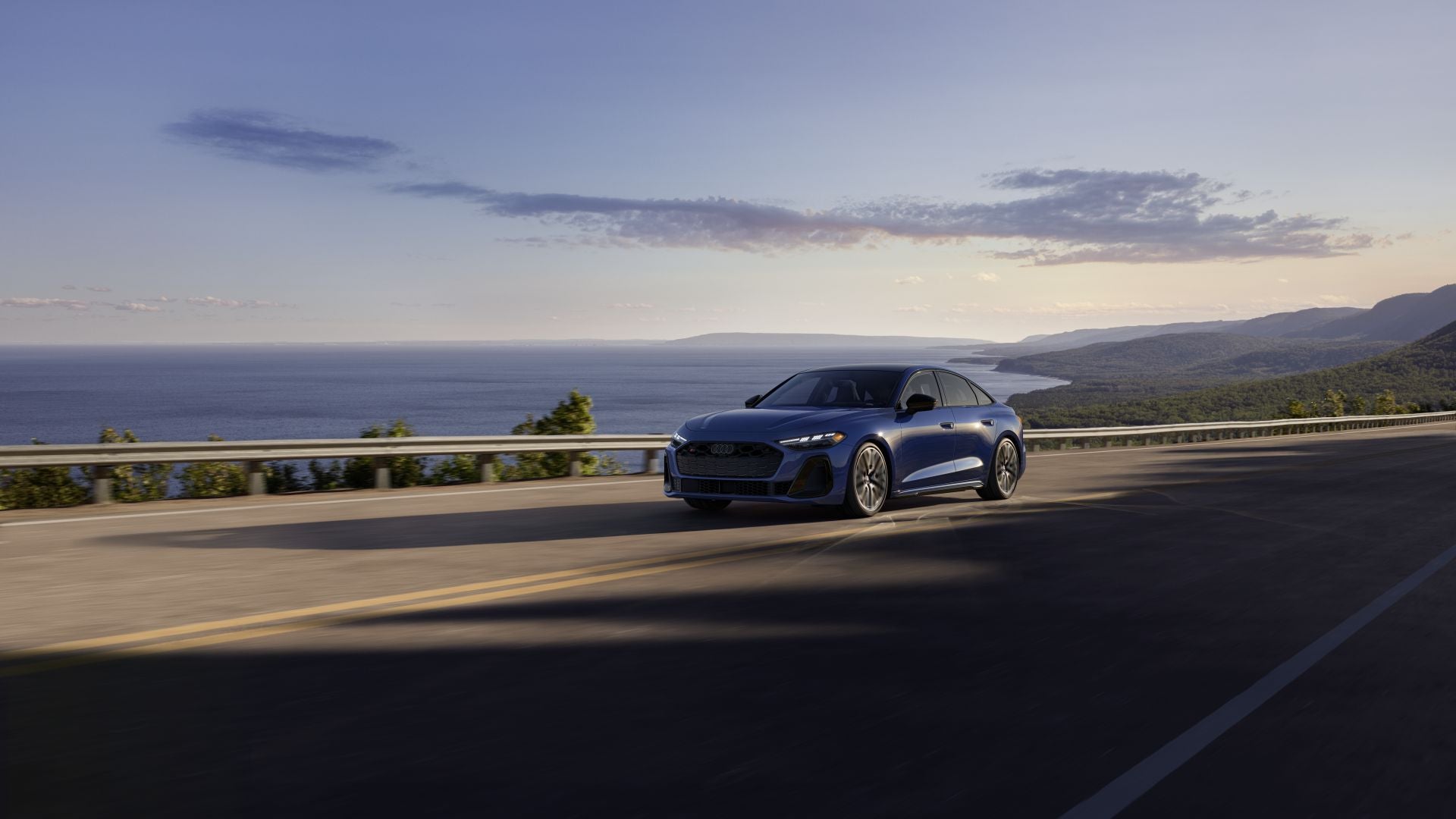 Right front profile of an Audi S5 accelerating.